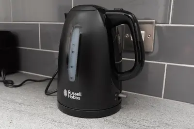 a black tea kettle sitting on a counter at 3-Bed Coastal Retreat in Waterloo