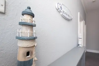 a lighthouse decoration on the wall of a room at 3-Bed Coastal Retreat in Waterloo