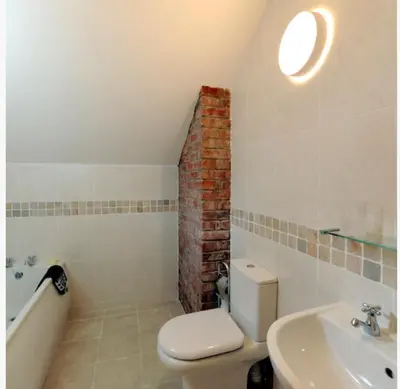 a bathroom with a toilet and a sink and a bath tub at Marsh Farm Hall in Great Eccleston