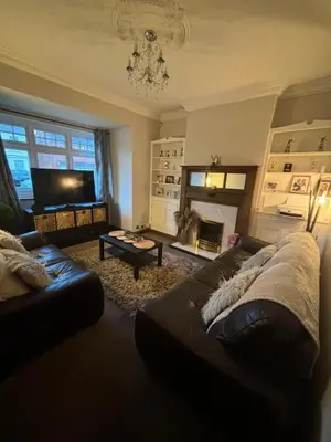 a living room with a couch and a fireplace at Birkdale Golf Open Holiday Home in Southport