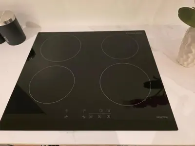 a black book with circles on it on a table at 2 Bedroom Apartments Near Anfield Stadium - Sleeps 4 per Flat in Liverpool