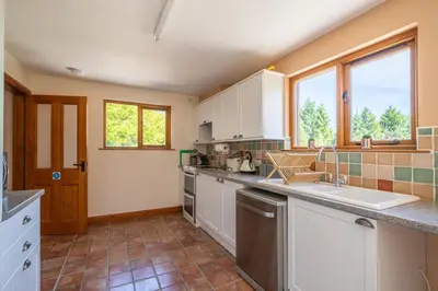 a kitchen with a sink and a counter top at Leighton Banks in Beetham