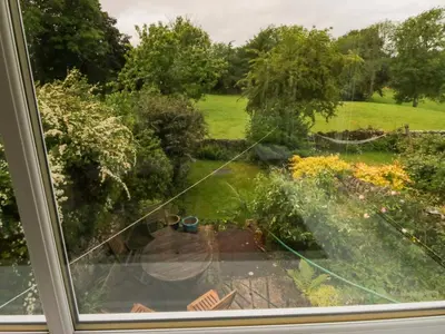 a view of a garden from a window at 28 Rock Villas in Carnforth