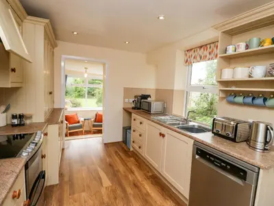 a kitchen with a sink and a counter top at 28 Rock Villas in Carnforth