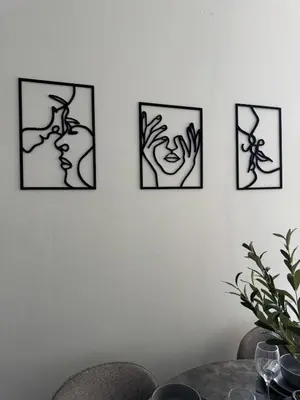 four framed pictures of hands on a wall at Homely stay Bootle Liverpool in Litherland