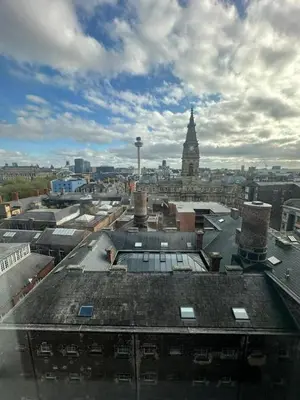 an aerial view of a city with a clock tower at City View One Bedroom Apartment by StaySavvy Accommodation in Liverpool
