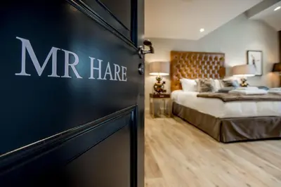 a bedroom with a mr haire sign on the wall at Freemasons at Wiswell in Whalley