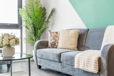 a living room with a couch and a table at Verona Apartment - City Apartment - 2Bed 2Bath in Liverpool