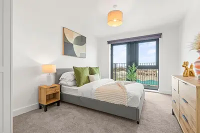 a bedroom with a bed and a window at Verona Apartment - City Apartment - 2Bed 2Bath in Liverpool