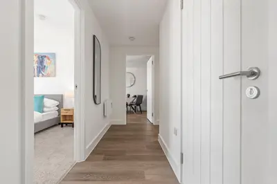 a hallway leading to a living room with a bedroom at Verona Apartment - City Apartment - 2Bed 2Bath in Liverpool