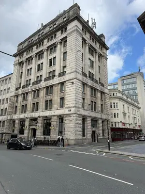 a large building on the corner of a street at Large city centre apartment in Liverpool