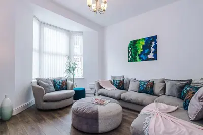 a living room with a couch and two chairs at Stunning & Spacious Home by 53 Degrees Property, Sleeps 7 in the heart of Anfield! in Liverpool