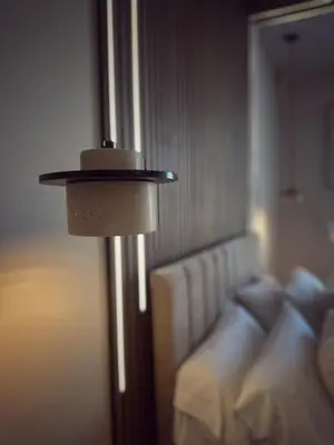 a lamp in a room next to a bed at Villa Rose-Spacious Home with beautiful garden in Lytham St Annes