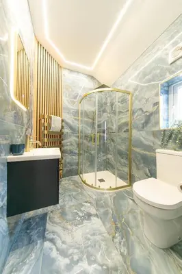a bathroom with a toilet and a shower at Villa Rose-Spacious Home with beautiful garden in Lytham St Annes