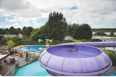 a large swimming pool with people in the water at Haven SAN 107 in Blackpool