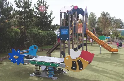 a playground with a slide in a park at Haven SAN 107 in Blackpool