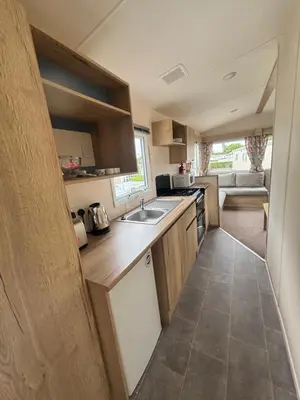 a kitchen with a sink and a counter top at Haven SAN 107 in Blackpool