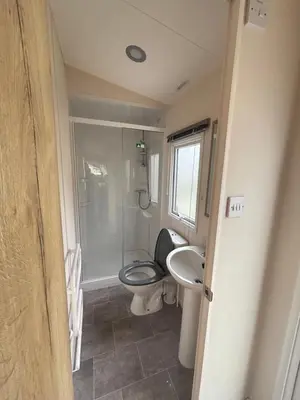 a bathroom with a toilet and a sink at Haven SAN 107 in Blackpool