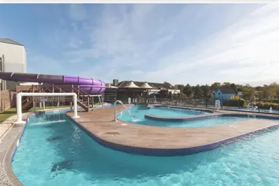 a large swimming pool with a water slide at Haven SAN 107 in Blackpool