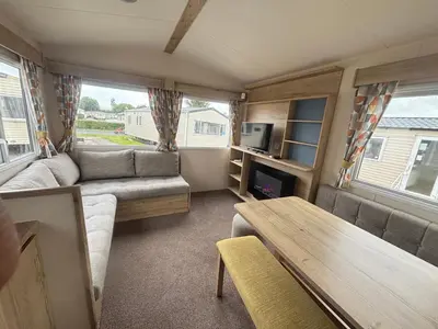 a living room with a couch and a table at Haven SAN 107 in Blackpool