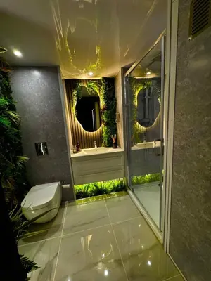 a bathroom with a toilet and a sink with mirrors at Woodland Escapes Glamping - Utopia