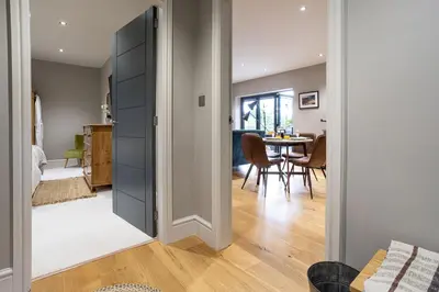 a living room with a door leading to a dining room at Hen Harrier Lodge in Lancaster