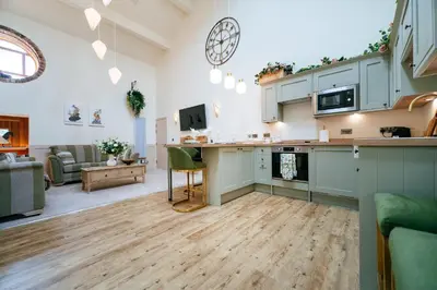 an open kitchen and living room with a counter top at The Stables at The Talbot in Lytham St Annes