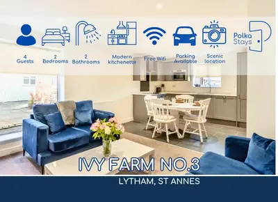a living room with a blue couch and a table at No 3 PolkaStays Ivy Farm Coach House Family Suite in Plumpton