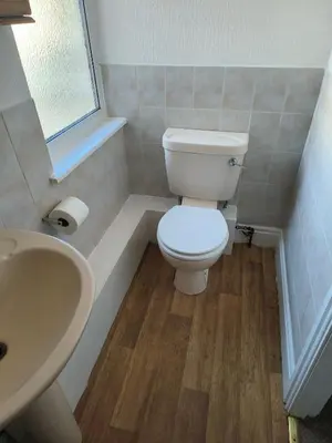 a bathroom with a white toilet and a sink at Springfield house holiday apartments in Blackpool