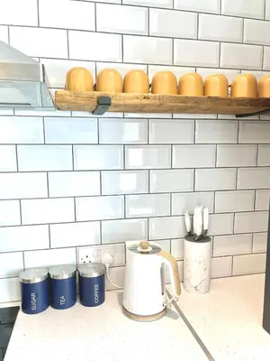 a kitchen counter with a coffee pot and eggs on a shelf at Ideal 4 Bed Home sleeps 7 Nr Middlebrook Stadium in Lostock