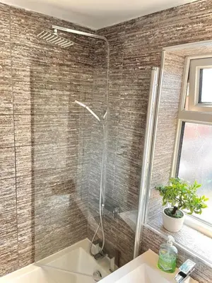 a bathroom with a shower and a sink and a tub at Ideal 4 Bed Home sleeps 7 Nr Middlebrook Stadium in Lostock
