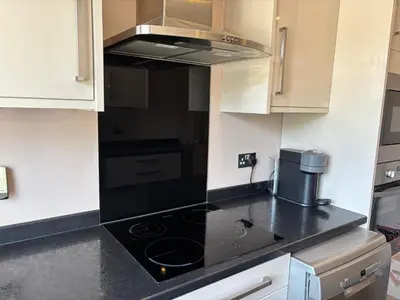 a kitchen with a black stove top oven at SmithStayz Poulton in Poulton le Fylde