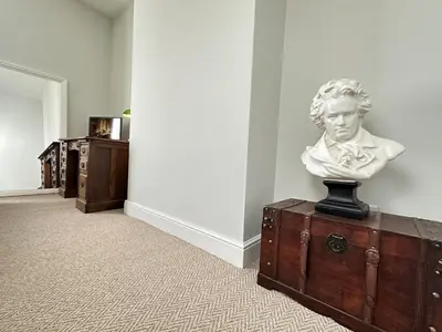 a statue of a bust on top of a chest at Stylish Highland-Theme 2BR Sefton Park in Liverpool