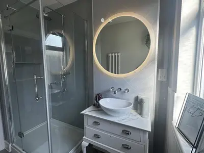 a bathroom with a sink and a shower at Stylish Highland-Theme 2BR Sefton Park in Liverpool
