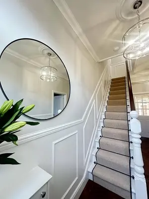 a stairway with a mirror on the wall at Stylish Highland-Theme 2BR Sefton Park in Liverpool