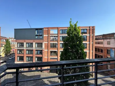 a view of a building from a balcony at Balcony Free Parking Huge TV City Centre Apt in Liverpool