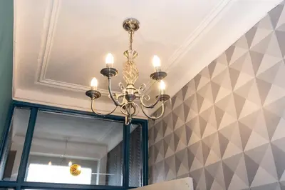 a chandelier hanging from a ceiling with a mirror at Very Spacious 2 Bath Free Parking in Liverpool