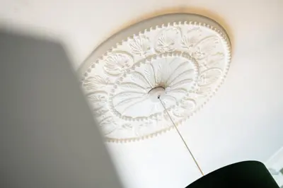 a white ceiling fan hanging from a wall at Watford Lodge - Air Host & Stay - A Home in the Heart of Anfield in Liverpool