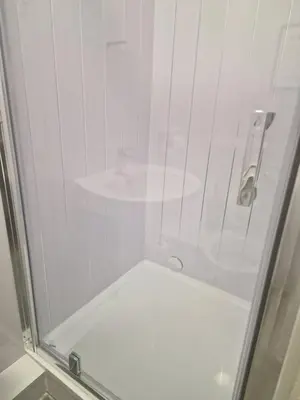 a shower with a glass door in a bathroom at Excellent Suite Room in Liverpool in Liverpool