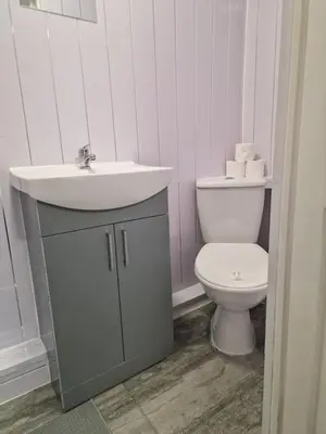a bathroom with a sink and a toilet at Excellent Suite Room in Liverpool in Liverpool