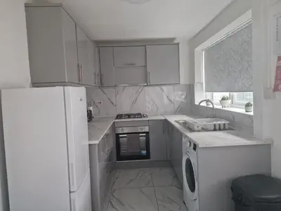 a kitchen with white appliances and a white refrigerator at Excellent Suite Room in Liverpool in Liverpool