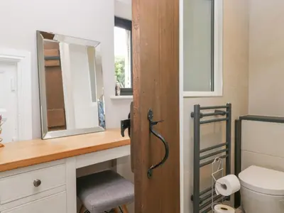 a bathroom with a sink and a mirror at Lindeth Croft in Carnforth