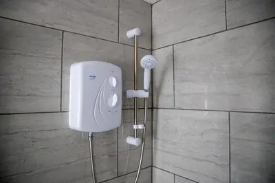 a soap dispenser on the wall of a bathroom at Balmoral Stays 4 - First Floor in Blackpool