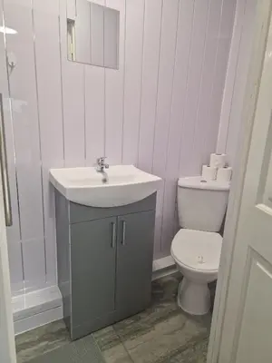 a bathroom with a sink and a toilet at Sleeps 10- Free Parking- Close To Goodison&Anfield in Liverpool