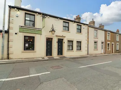 a building on the side of a street at Lakes View Apartment 1 in Carnforth