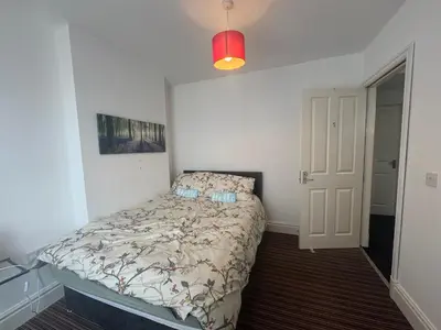 a small bedroom with a bed in a room at Bay Walk Place in Morecambe