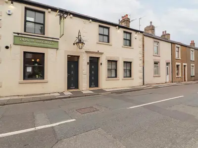 a row of buildings on the side of a street at Lakes View Apartment 2 in Carnforth