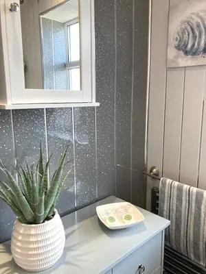 a bathroom with a plant sitting on a counter at Palm House Lytham St Annes in Lytham St Annes