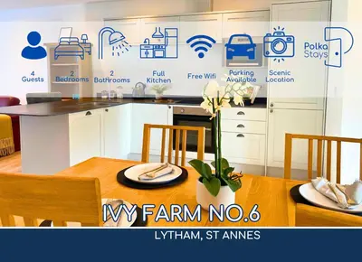 a kitchen with a table with chairs and a sign that reads vm farm no at No 6 PolkaStays Ivy Farm Orchard Suite in Plumpton