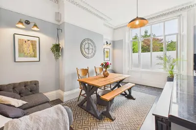 a living room with a table and a couch at Host & Stay - Beech Street in Liverpool